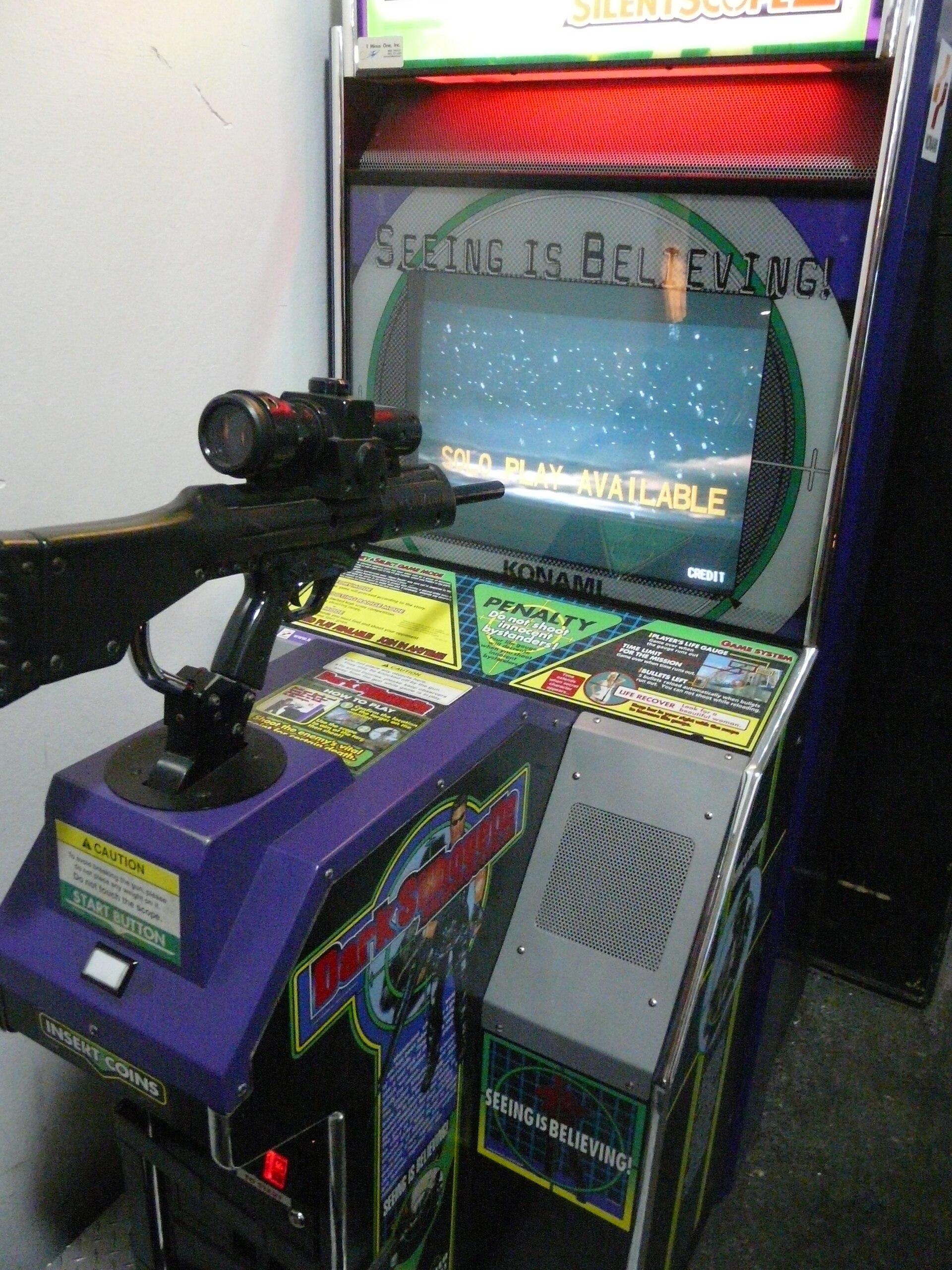 Imagem de referência relacionada a Silent Scope 2: Dark Silhouette, item descrito como videojogo de 2001